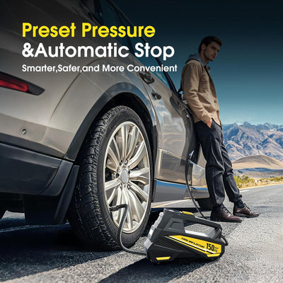 Person using a tire inflator on a car with mountains in the background